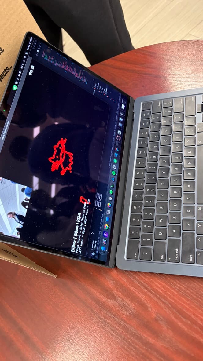 OpenCV drawing program running on a laptop at the exhibition